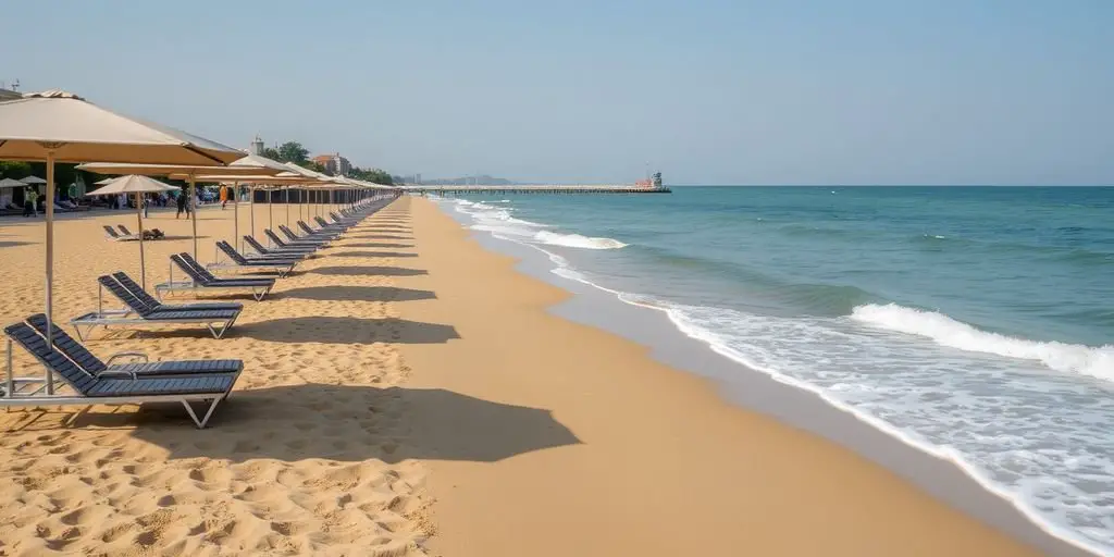 Lido beach in Venice with sun loungers and umbrellas.